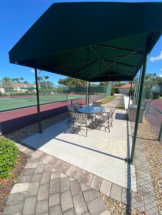 4239 Corso Venetia Blvd, Venice, FL 34293 - view of patio featuring a tennis court