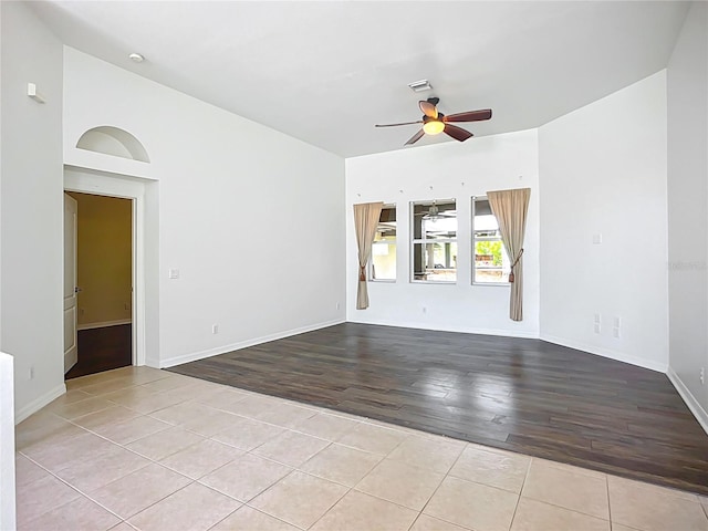 4239 Corso Venetia Blvd, Venice, FL 34293 - empty room with wood finished floors, ceiling fan, and baseboards