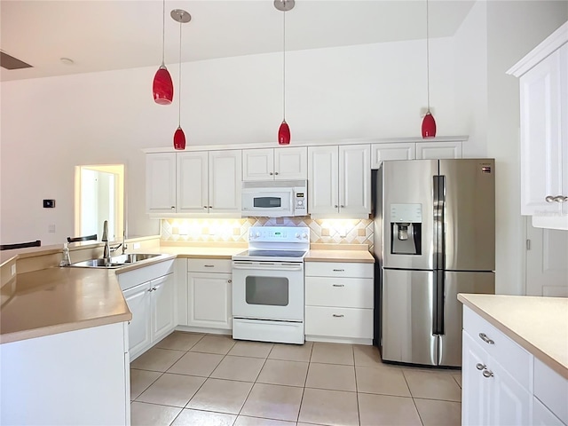 4239 Corso Venetia Blvd, Venice, FL 34293 - kitchen featuring white appliances, decorative backsplash, light countertops, light tile patterned floors, and a sink