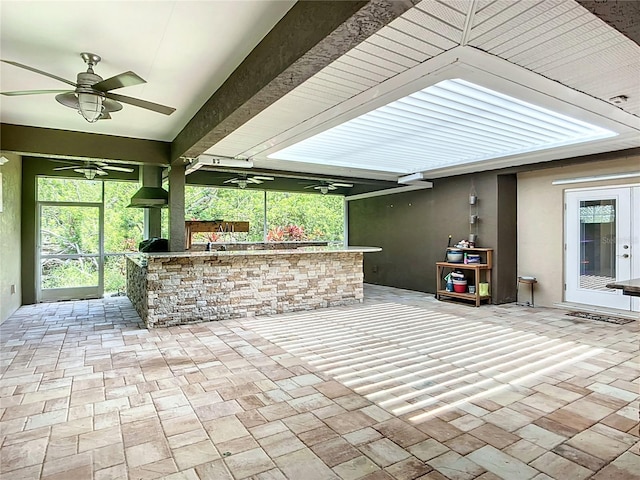 4239 Corso Venetia Blvd, Venice, FL 34293 - view of patio featuring ceiling fan, exterior bar, and french doors