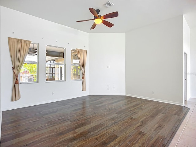 4239 Corso Venetia Blvd, Venice, FL 34293 - unfurnished room featuring wood finished floors, ceiling fan, healthy amount of natural light, and baseboards