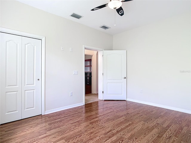 4239 Corso Venetia Blvd, Venice, FL 34293 - unfurnished bedroom featuring wood finished floors, a closet, baseboards, and ceiling fan