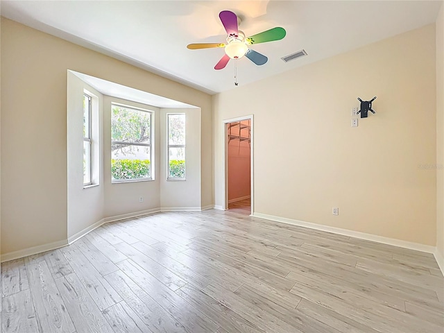 4239 Corso Venetia Blvd, Venice, FL 34293 - spare room featuring a ceiling fan, light wood-type flooring, and baseboards