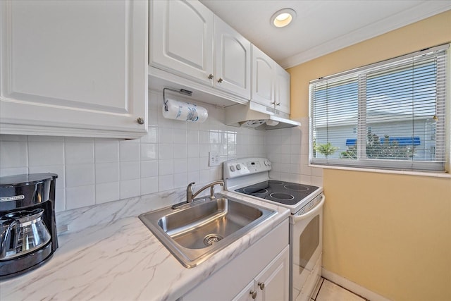 475 Benjamin Franklin Dr Unit 211, Sarasota, FL 34236 - kitchen with white range with electric stovetop, under cabinet range hood, a sink, white cabinets, and crown molding
