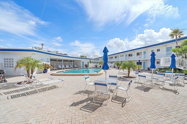 475 Benjamin Franklin Dr Unit 211, Sarasota, FL 34236 - community pool with a patio area