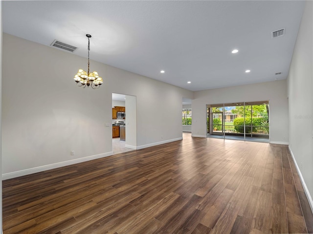6248 Donnington Ct, Sarasota, FL 34238 - spare room with a chandelier, dark wood-style floors, baseboards, and recessed lighting