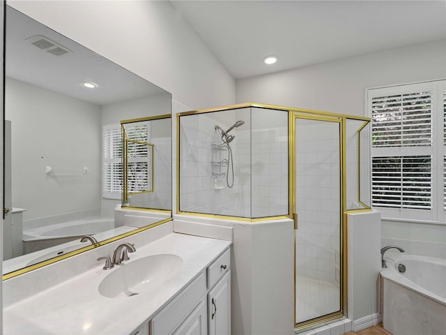 6248 Donnington Ct, Sarasota, FL 34238 - full bathroom with a stall shower, a garden tub, vanity, and recessed lighting