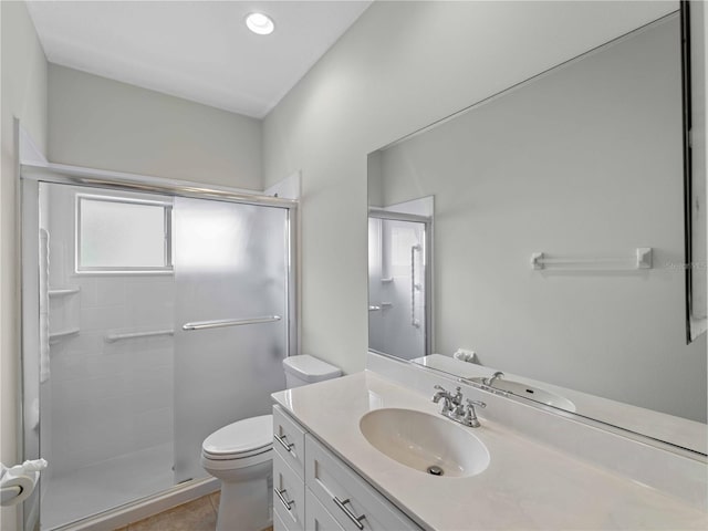 6248 Donnington Ct, Sarasota, FL 34238 - bathroom featuring toilet, a shower stall, vanity, and tile patterned floors