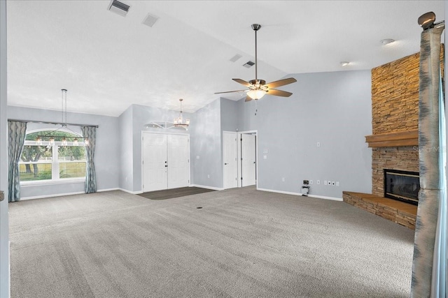 10001 289th St E, Myakka City, FL 34251 - unfurnished living room featuring carpet, a stone fireplace, ceiling fan, high vaulted ceiling, and a chandelier