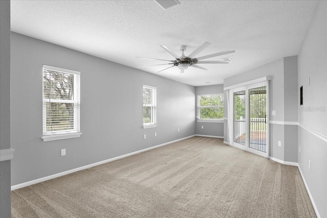 10001 289th St E, Myakka City, FL 34251 - spare room featuring a textured ceiling, ceiling fan, and carpet flooring