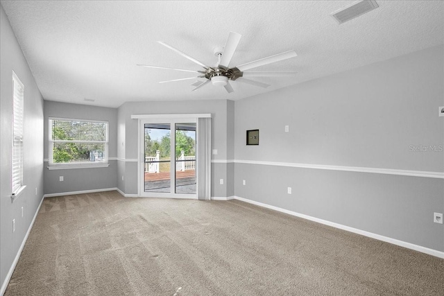 10001 289th St E, Myakka City, FL 34251 - spare room with a ceiling fan, a textured ceiling, and carpet flooring