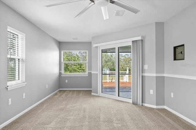 10001 289th St E, Myakka City, FL 34251 - carpeted empty room featuring a ceiling fan and a textured ceiling