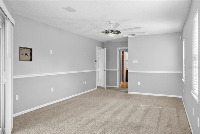 10001 289th St E, Myakka City, FL 34251 - carpeted empty room featuring a ceiling fan and a textured ceiling