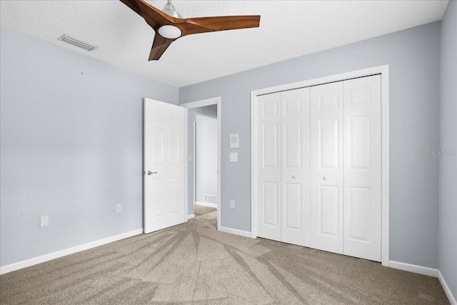10001 289th St E, Myakka City, FL 34251 - unfurnished bedroom with carpet floors, a closet, and ceiling fan