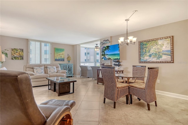 5916 Midnight Pass Rd Unit 404, Sarasota, FL 34242 - dining area featuring plenty of natural light, a chandelier, light tile patterned floors, and baseboards