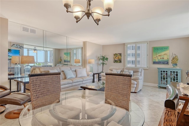 5916 Midnight Pass Rd Unit 404, Sarasota, FL 34242 - living room with a chandelier, baseboards, and light tile patterned floors