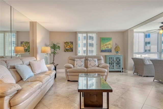 5916 Midnight Pass Rd Unit 404, Sarasota, FL 34242 - living room with plenty of natural light, baseboards, ceiling fan, and light tile patterned floors