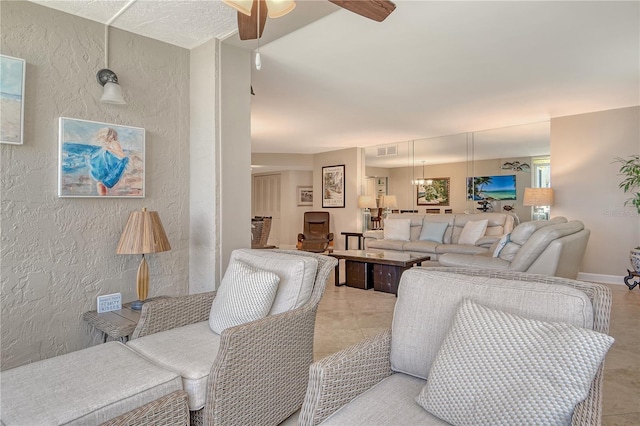 5916 Midnight Pass Rd Unit 404, Sarasota, FL 34242 - living area featuring a textured wall and a ceiling fan