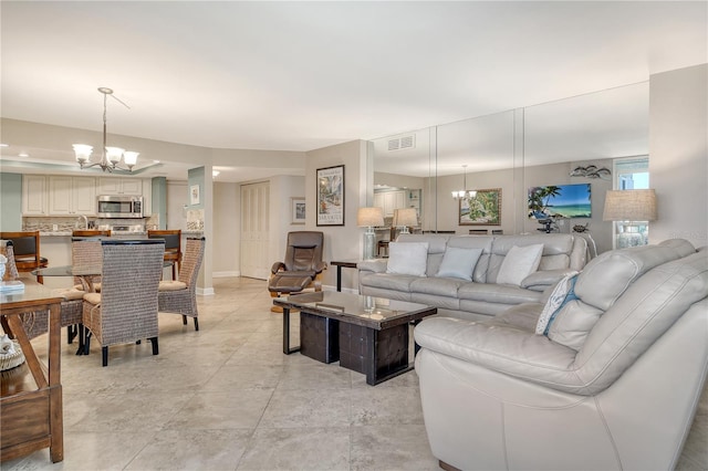 5916 Midnight Pass Rd Unit 404, Sarasota, FL 34242 - living area featuring a chandelier and baseboards