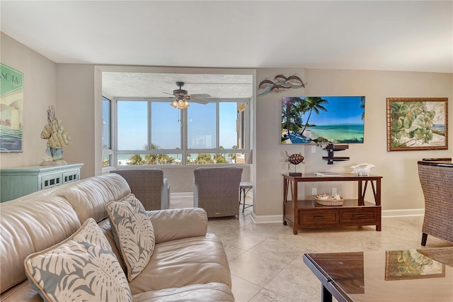 5916 Midnight Pass Rd Unit 404, Sarasota, FL 34242 - living room with ceiling fan, baseboards, and light tile patterned floors