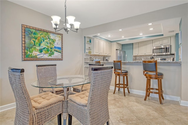 5916 Midnight Pass Rd Unit 404, Sarasota, FL 34242 - dining room featuring a chandelier, recessed lighting, a tray ceiling, and baseboards