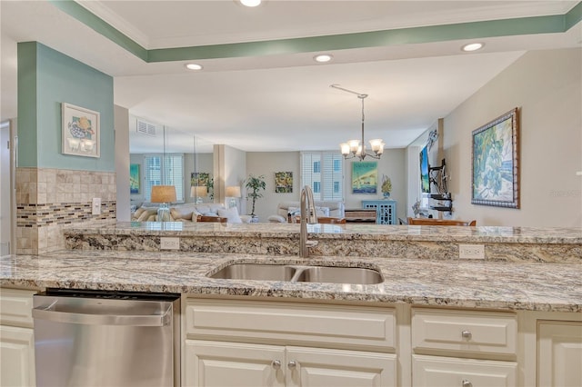 5916 Midnight Pass Rd Unit 404, Sarasota, FL 34242 - kitchen with stainless steel dishwasher, a sink, open floor plan, a chandelier, and light stone countertops