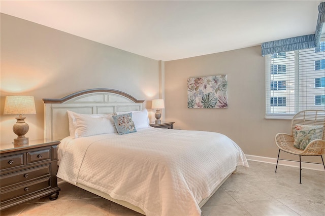 5916 Midnight Pass Rd Unit 404, Sarasota, FL 34242 - bedroom with baseboards and light tile patterned floors