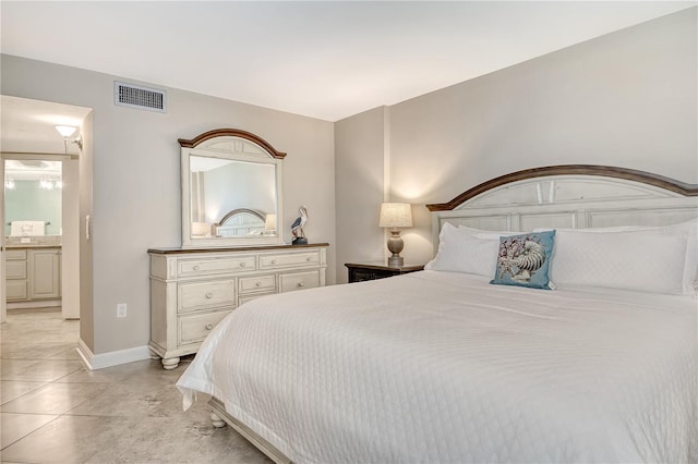 5916 Midnight Pass Rd Unit 404, Sarasota, FL 34242 - bedroom featuring baseboards and ensuite bath