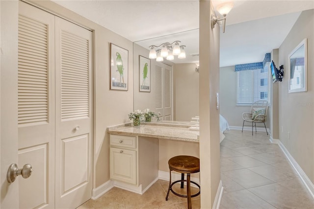 5916 Midnight Pass Rd Unit 404, Sarasota, FL 34242 - bathroom with a closet, tile patterned flooring, and baseboards