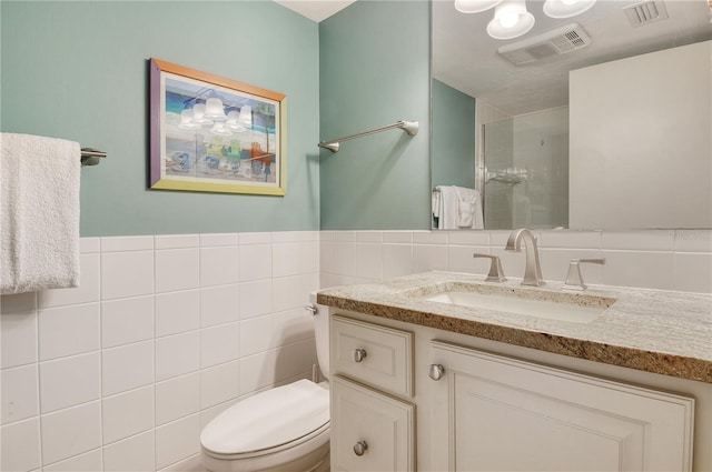 5916 Midnight Pass Rd Unit 404, Sarasota, FL 34242 - bathroom featuring a shower stall, tile walls, toilet, and vanity