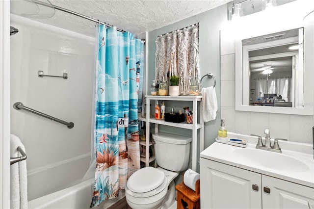 full bathroom with toilet, a textured ceiling, vanity, and shower / bath combination with curtain