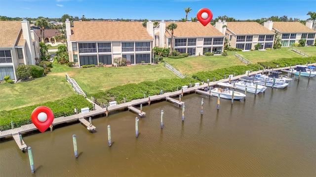 8710 54th Ave W Unit 8710, Bradenton, FL 34210 - dock area with a water view, a residential view, and a lawn