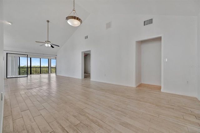 8710 54th Ave W Unit 8710, Bradenton, FL 34210 - spare room with a ceiling fan, high vaulted ceiling, and light wood-style flooring