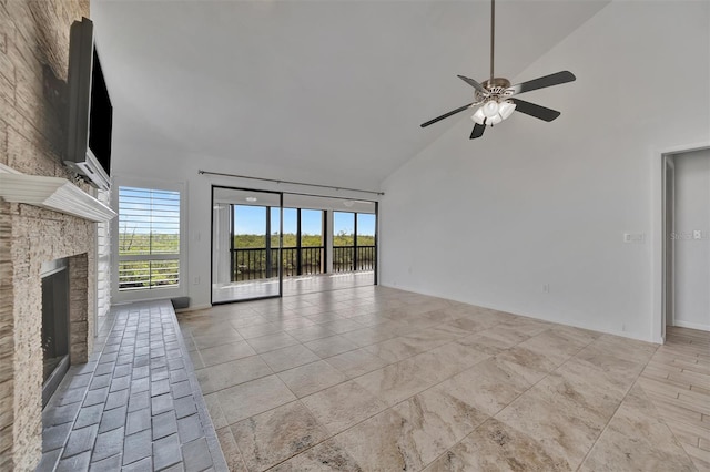 8710 54th Ave W Unit 8710, Bradenton, FL 34210 - unfurnished living room featuring high vaulted ceiling, ceiling fan, plenty of natural light, and a stone fireplace