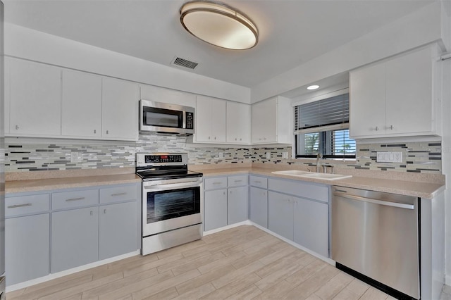 8710 54th Ave W Unit 8710, Bradenton, FL 34210 - kitchen featuring stainless steel appliances, a sink, and light countertops