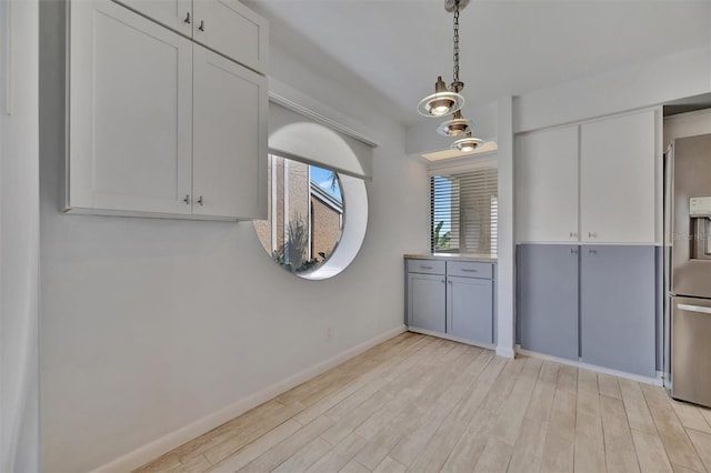 8710 54th Ave W Unit 8710, Bradenton, FL 34210 - unfurnished dining area featuring light wood-style floors and baseboards