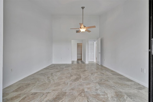 8710 54th Ave W Unit 8710, Bradenton, FL 34210 - empty room featuring a ceiling fan and a towering ceiling