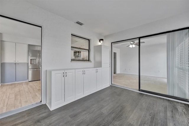 8710 54th Ave W Unit 8710, Bradenton, FL 34210 - spare room featuring wood finished floors and ceiling fan