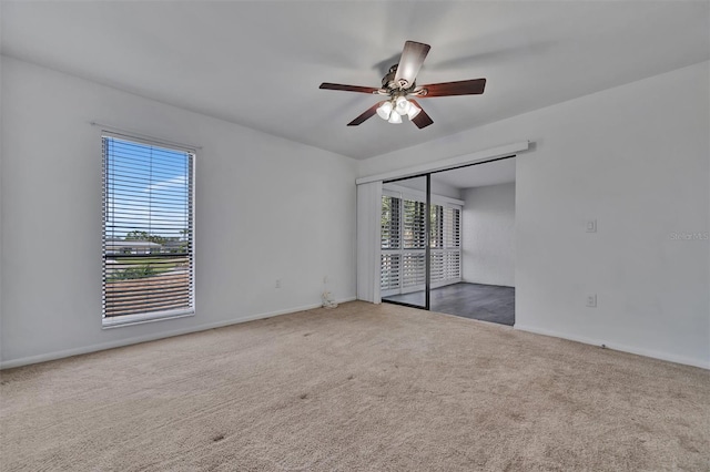8710 54th Ave W Unit 8710, Bradenton, FL 34210 - spare room with carpet floors, a ceiling fan, and baseboards