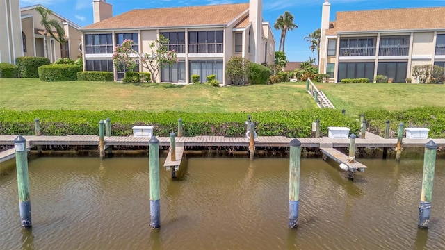 8710 54th Ave W Unit 8710, Bradenton, FL 34210 - dock area with a water view and a yard
