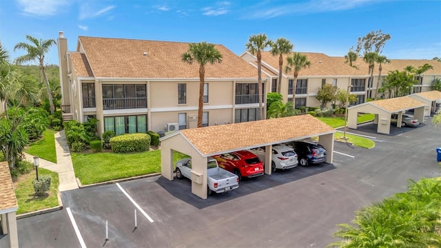 8710 54th Ave W Unit 8710, Bradenton, FL 34210 - view of property featuring covered and uncovered parking