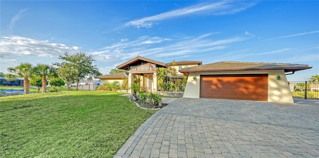 5500 Merrimac Dr, Sarasota, FL 34231 - view of front facade featuring a garage, decorative driveway, and stucco siding