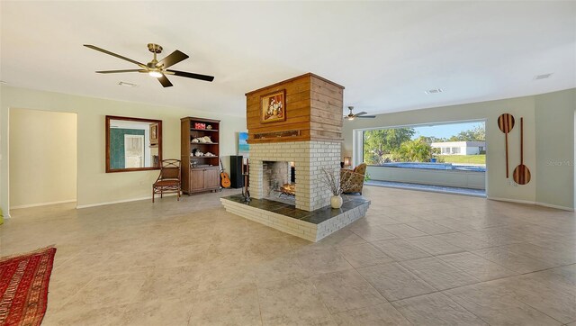5500 Merrimac Dr, Sarasota, FL 34231 - unfurnished living room with a ceiling fan, baseboards, a brick fireplace, and tile patterned floors