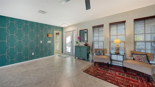 5500 Merrimac Dr, Sarasota, FL 34231 - foyer entrance with plenty of natural light, a ceiling fan, and wallpapered walls