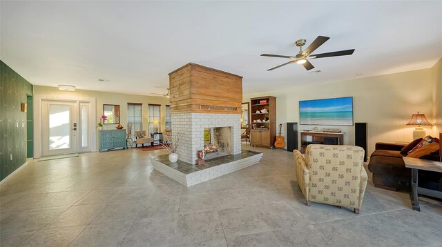 5500 Merrimac Dr, Sarasota, FL 34231 - living area featuring a ceiling fan, a brick fireplace, and light tile patterned flooring