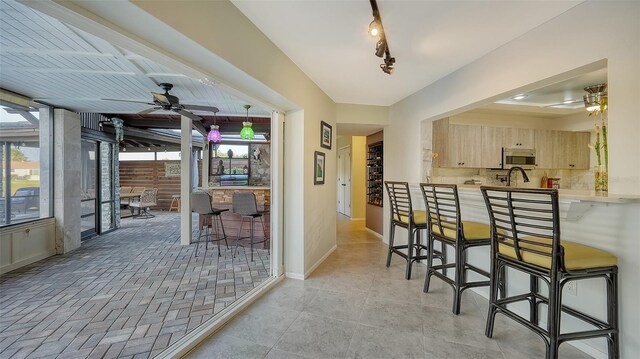 5500 Merrimac Dr, Sarasota, FL 34231 - hall featuring baseboards and a sink