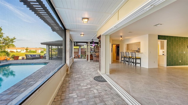 5500 Merrimac Dr, Sarasota, FL 34231 - view of patio with an outdoor pool