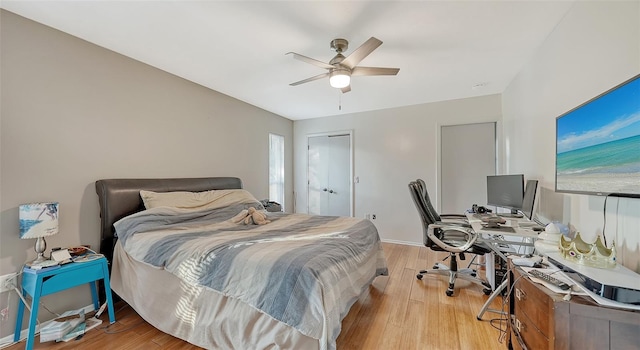 5500 Merrimac Dr, Sarasota, FL 34231 - bedroom with a desk, wood finished floors, a ceiling fan, and baseboards