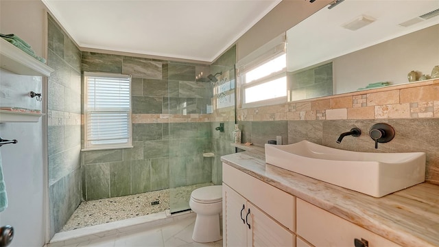5500 Merrimac Dr, Sarasota, FL 34231 - full bathroom with tile walls, toilet, walk in shower, vanity, and crown molding