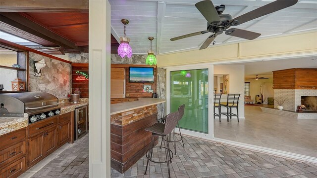 5500 Merrimac Dr, Sarasota, FL 34231 - view of patio with ceiling fan, area for grilling, and beverage cooler
